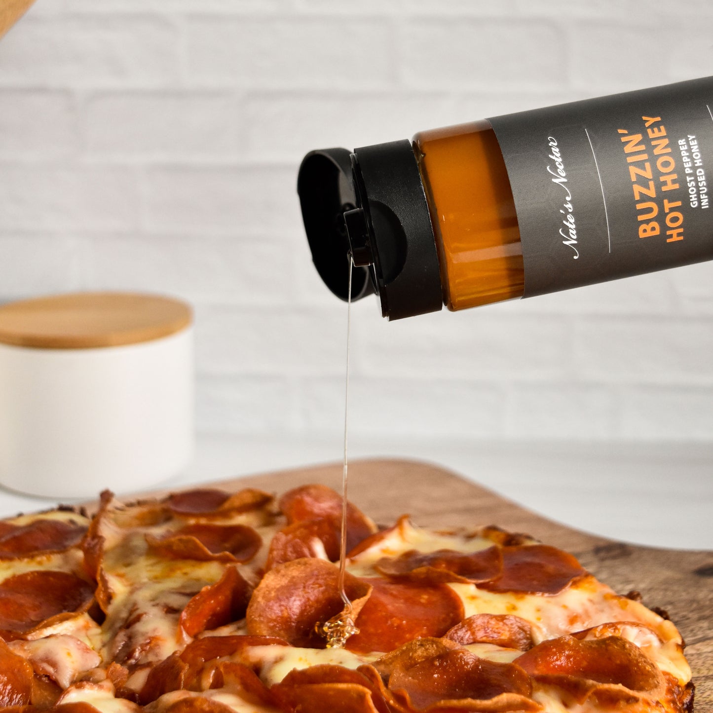 Nate's Nectar Buzzin' Hot Honey, Hot Honey, squeeze bottle, hot honey drizzled on hot honey pizza