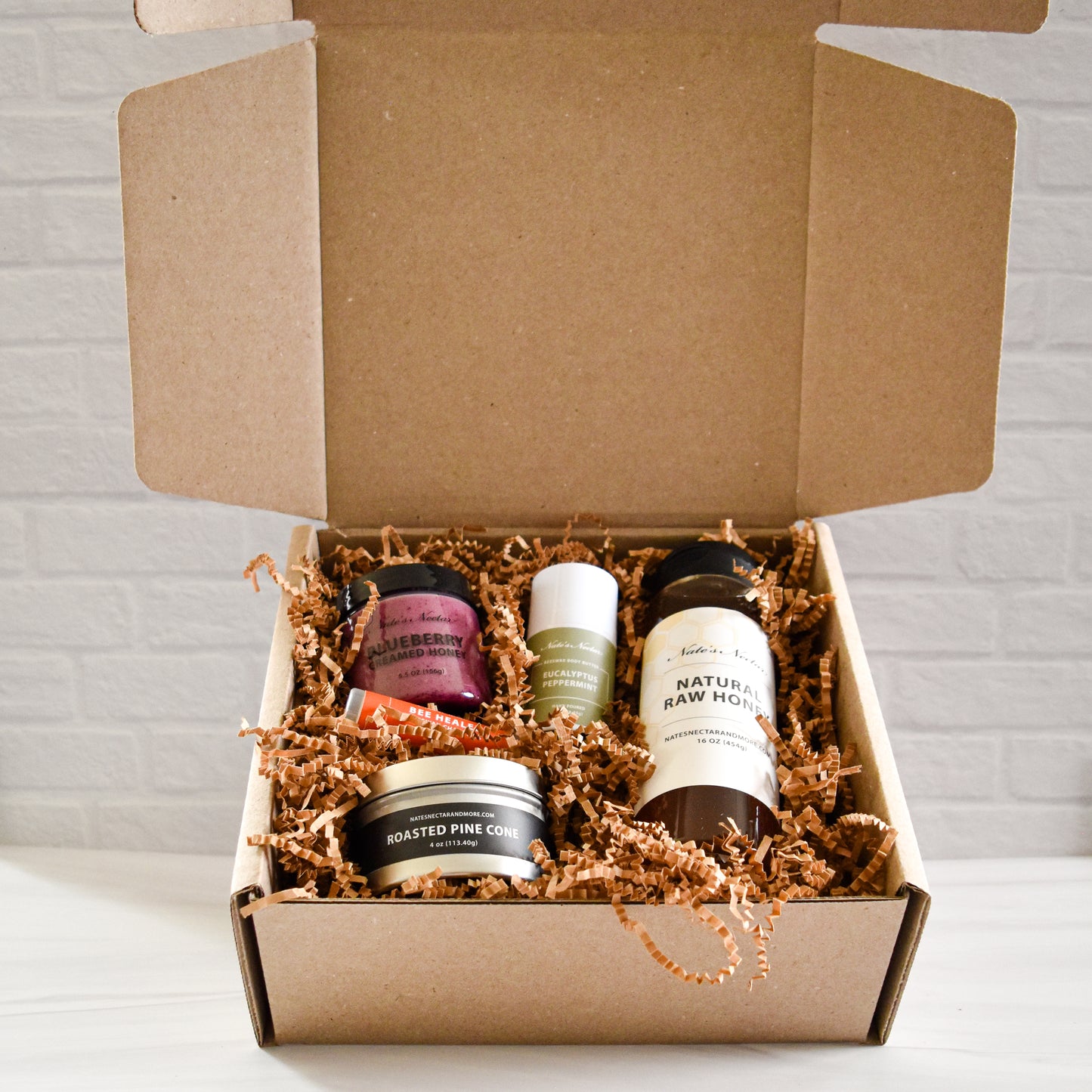 Nate's Nectar Essentials Holiday Gift Box, prepackaged holiday gift, raw honey, creamed honey, beeswax candle, beeswax skin care, gift giving season