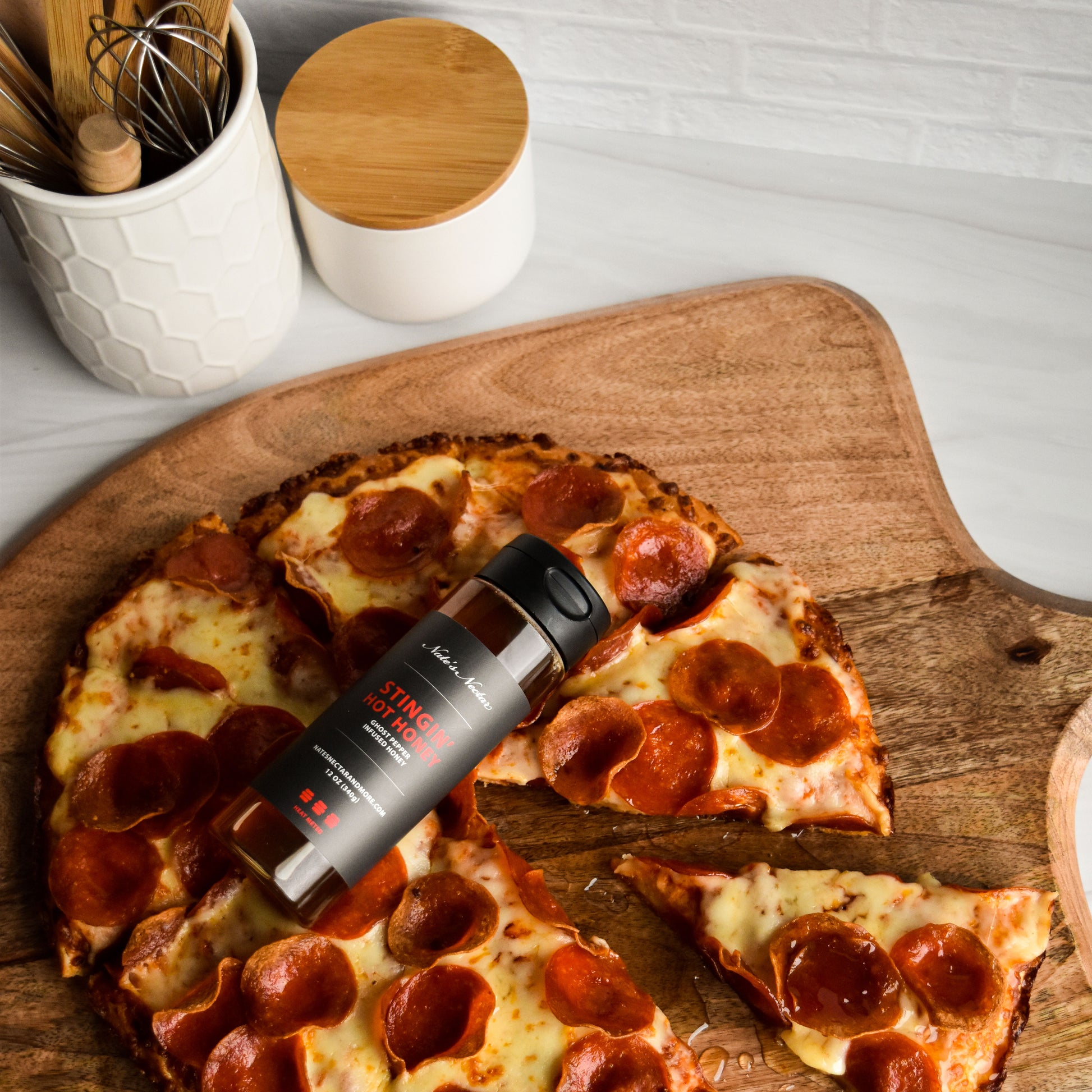 Nate's Nectar Stingin' Hot Honey, hot honey drizzled on pizza, ghost pepper infused honey